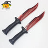 A pair of realistic bloody knife Halloween props featuring a dark handle and a red blade.