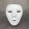 A smooth, white, mask with an ancient style design is displayed against a gray background.