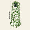 A vertical display of realistic hanging artificial ivy vines used for indoor and outdoor decor.