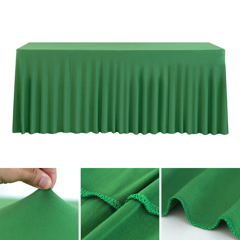 A smooth, emerald green stretch rectangle tablecloth draped over a table.