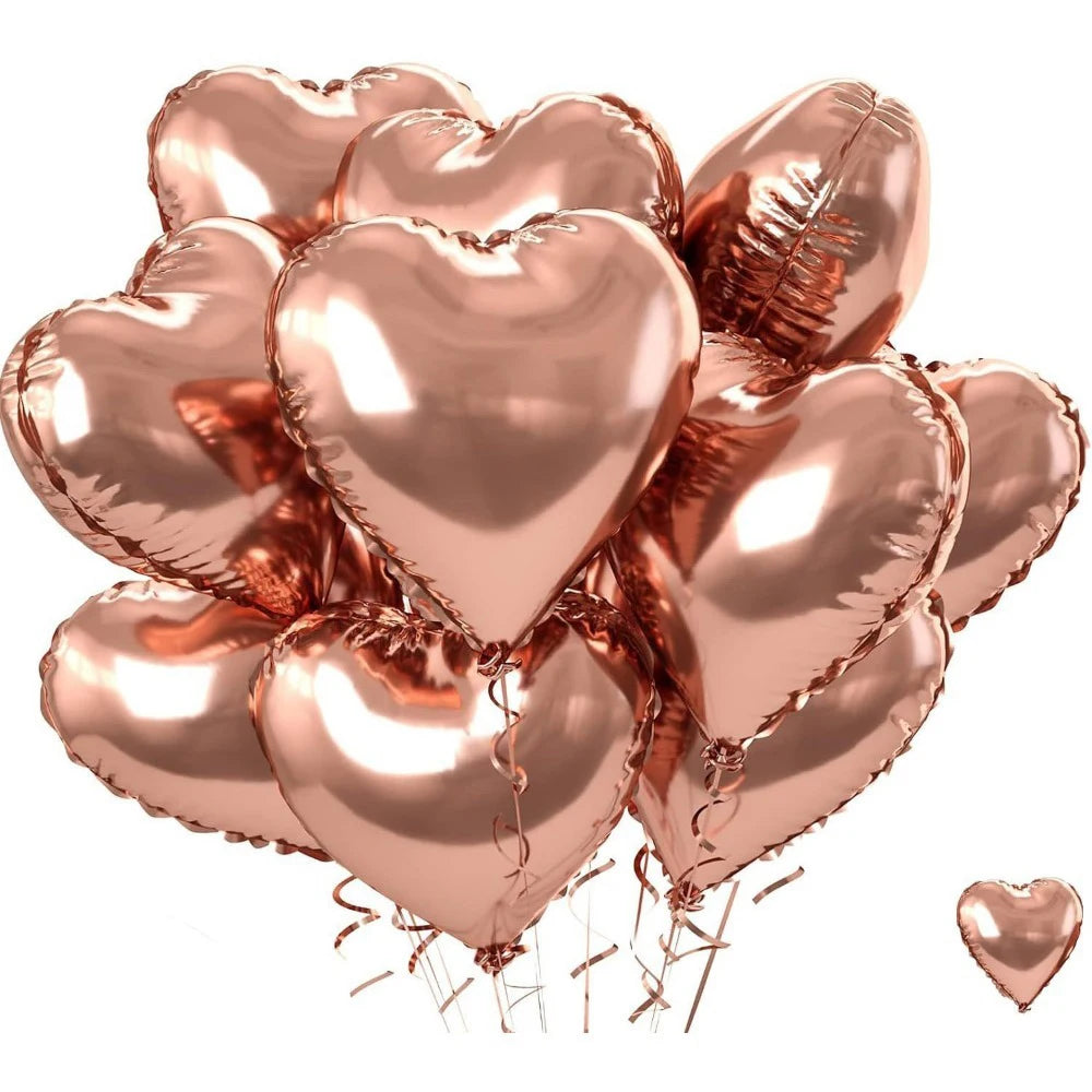 Ein Cluster metallisch-pinker Herzballons aus Folie.