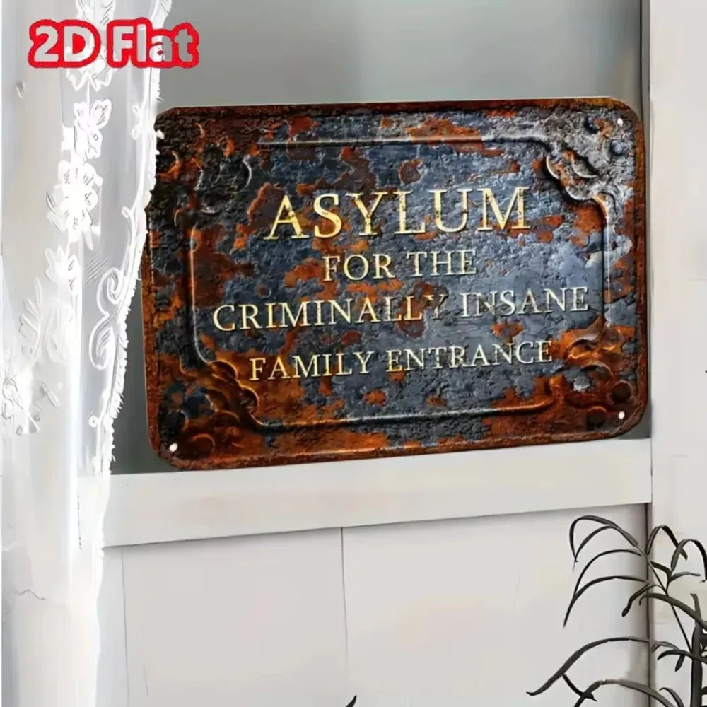 A vintage, rusted metal sign with the inscription Asylum for the Criminally Insane Family Entrance mounted on a white door.