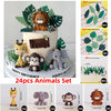 A set of 24 animal cake toppers featuring jungle and safari animals like a lion, monkey, elephant, and leaves.