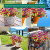 A collection of colorful outdoor artificial flowers in various pots and planters for garden decor