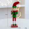 Handcrafted wooden nutcracker soldier figurine wearing a red hat and green uniform