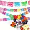 A colorful papel picado bunting banner featuring intricate cut-out designs in pink, blue, green, and orange for Mexican celeb