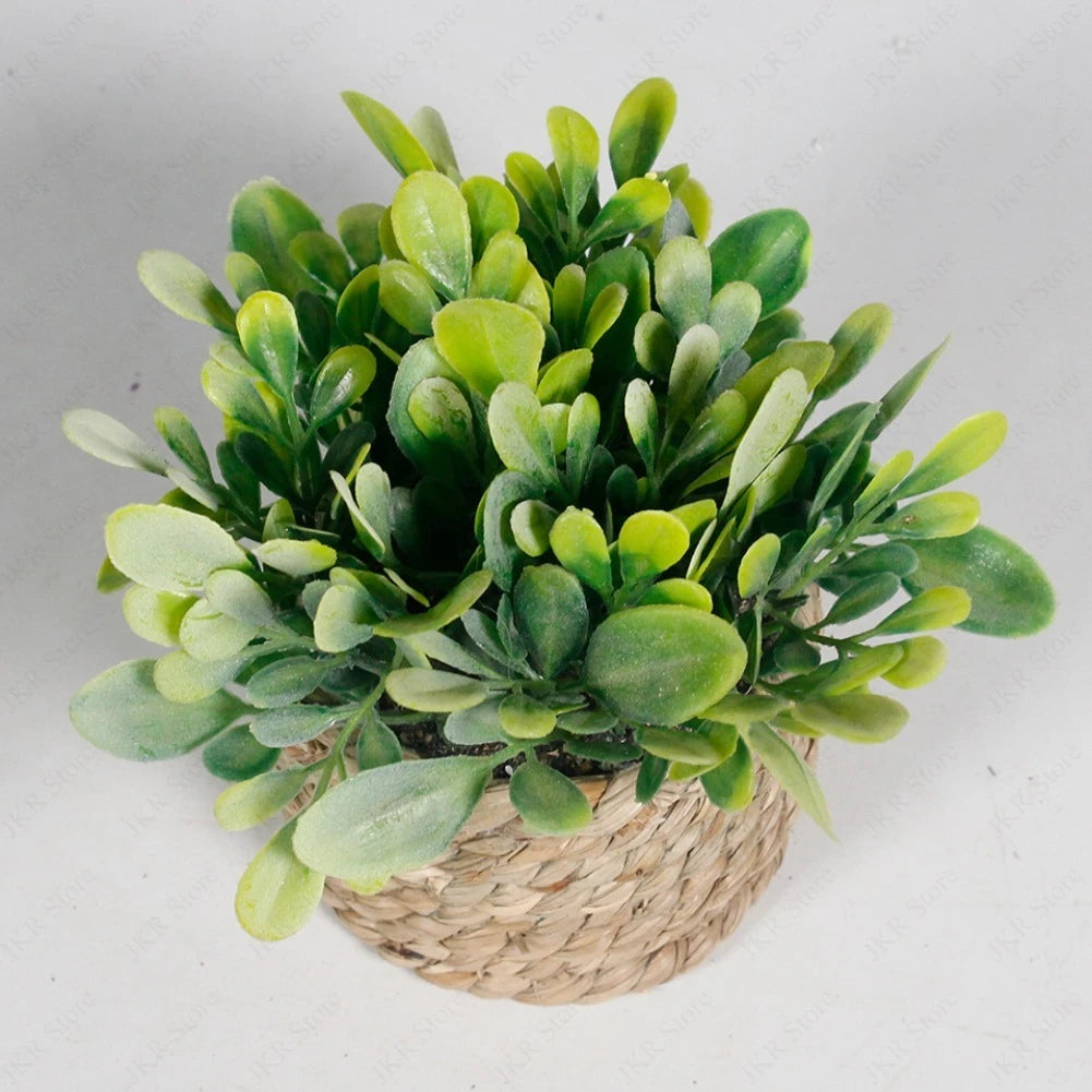 Artificial potted plant with green succulent leaves in a woven natural fiber pot