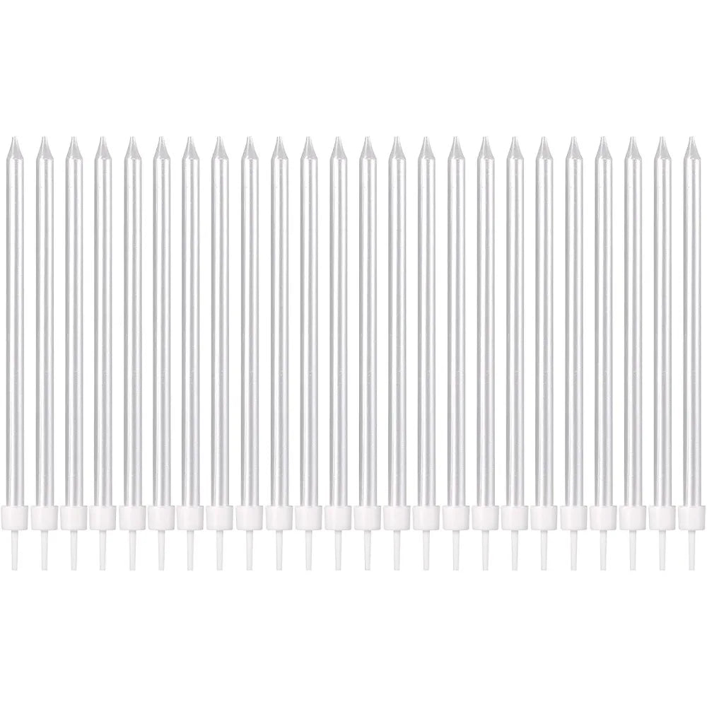 A row of white birthday candles with colored tips arranged horizontally.