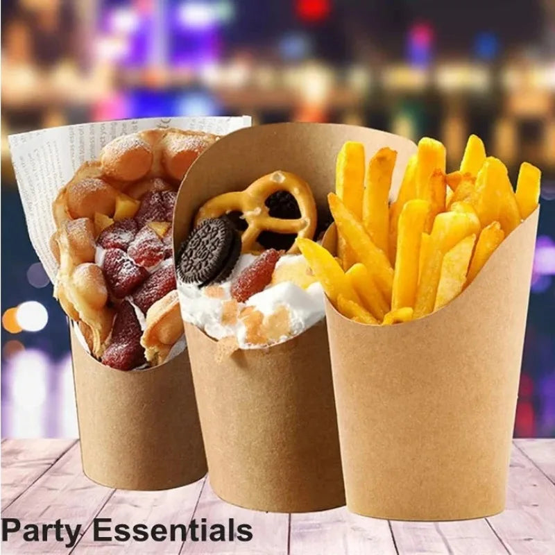 A close-up of three disposable kraft paper cups filled with french fries and toppings, presented as party essentials.