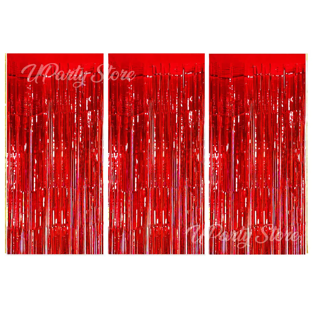 Three vertical panels of shiny red metallic fringe curtains used for party backdrop decor