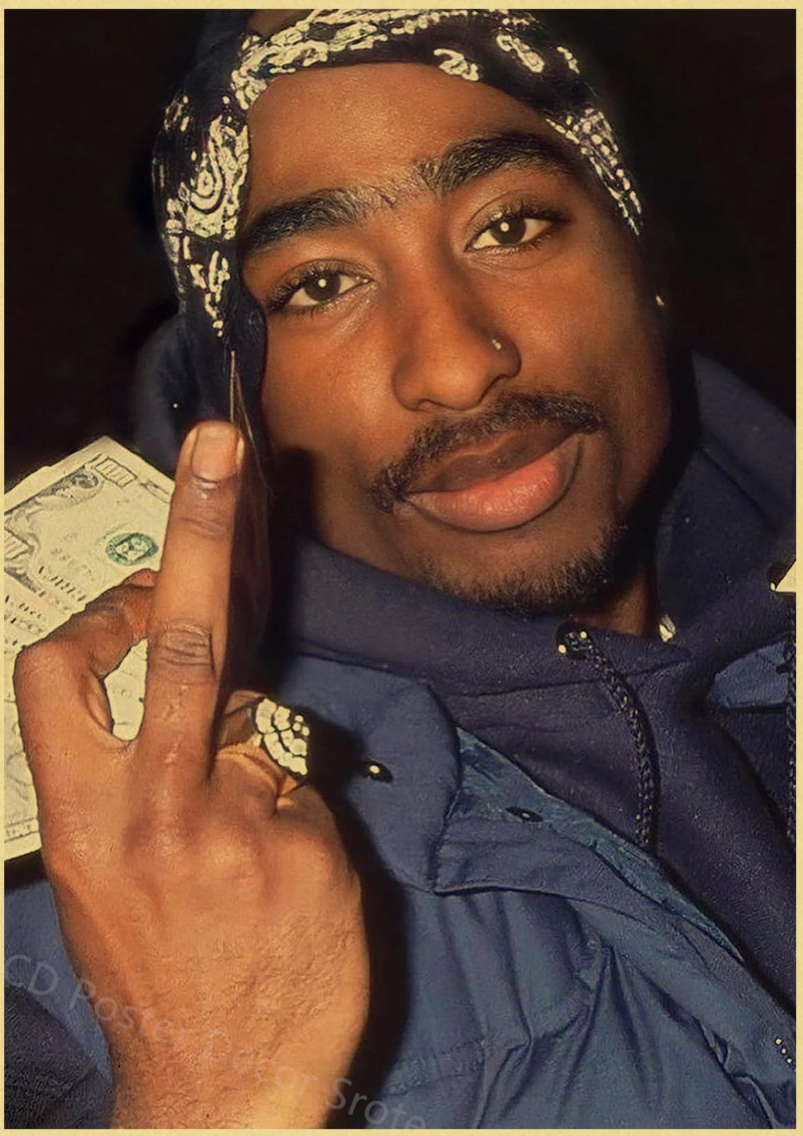 A close-up photo of a man wearing a patterned bandana and a dark jacket, holding a piece of paper with his finger.