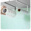 A hand is holding a roll of paper towel with decorative designs, demonstrating the storage solution for kitchen or bathroom s