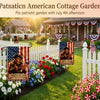 A patriotic garden scene featuring a white picket fence, colorful flowers, and a wooden house decorated with American flags.