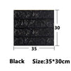 Black self-adhesive 3D foam wall panels measuring 35 by 30 centimeters