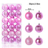 A box containing 36 pink and iridescent Christmas tree ornament balls.