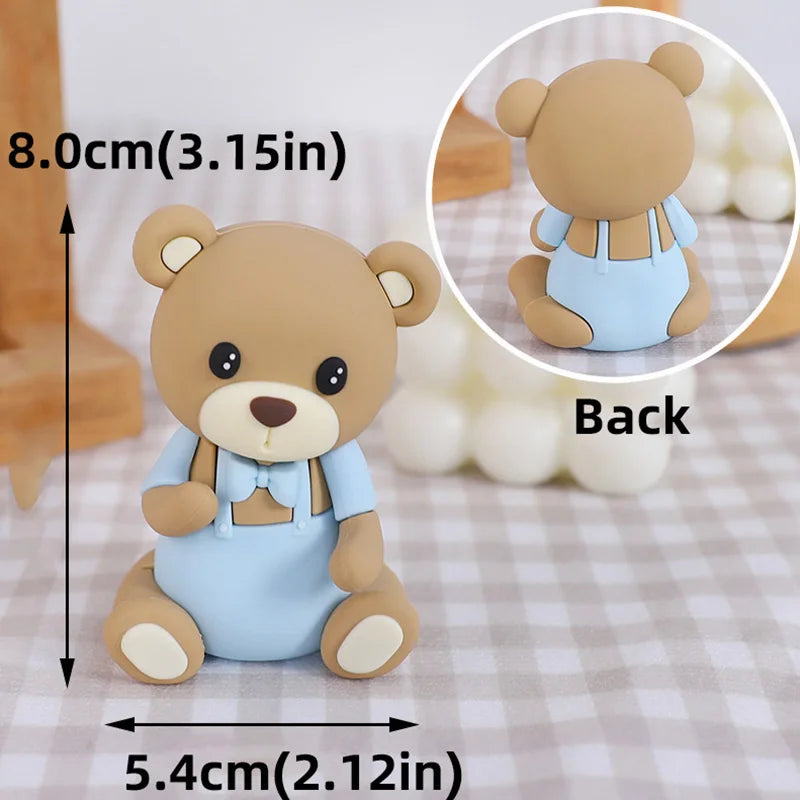 A cute, light blue cartoon elephant figure used as a cake topper.
