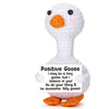 A white plush toy of a goose with an orange beak and feet, labeled Positive Goose.