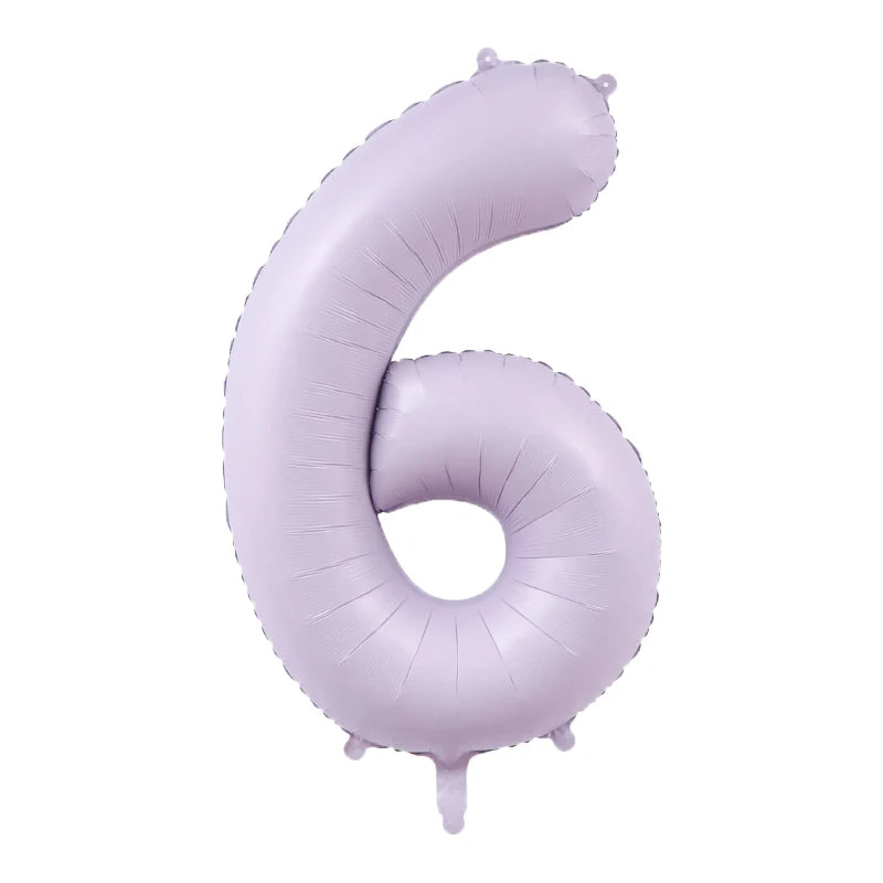 A purple foil number balloon shaped like the number six.