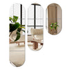 Three acrylic mirror wall stickers showing a modern interior with light wood furniture and green plants.