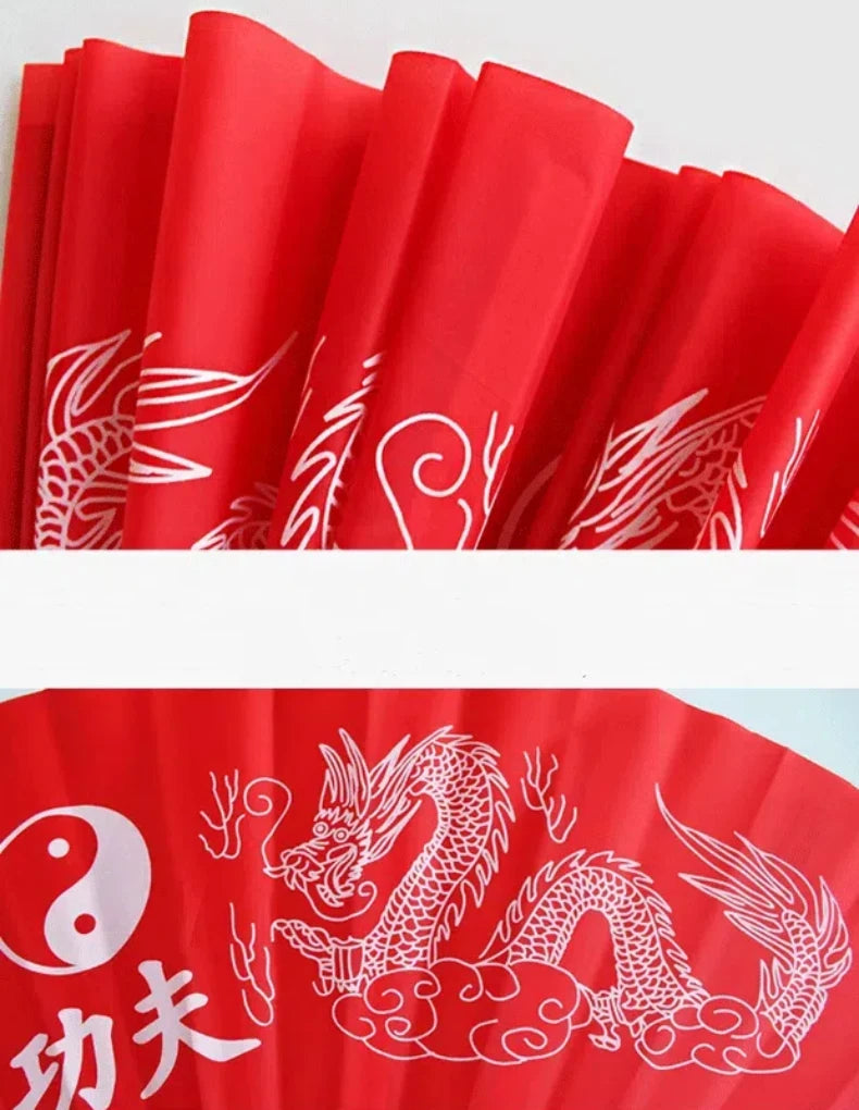 Red bamboo folding fan with white dragon design for martial arts and fitness