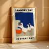 Laundry day canvas art print featuring a white duck and laundry basket with the text Laundry day is every day