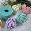 A collection of pastel silicone rose molds in various shades of pink, cream, and blue, displayed on a white surface.