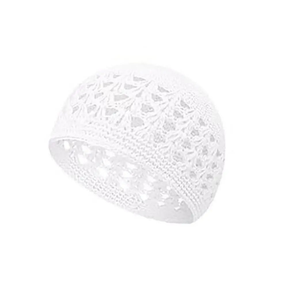 White handmade crochet beanie hat with an openwork lace pattern