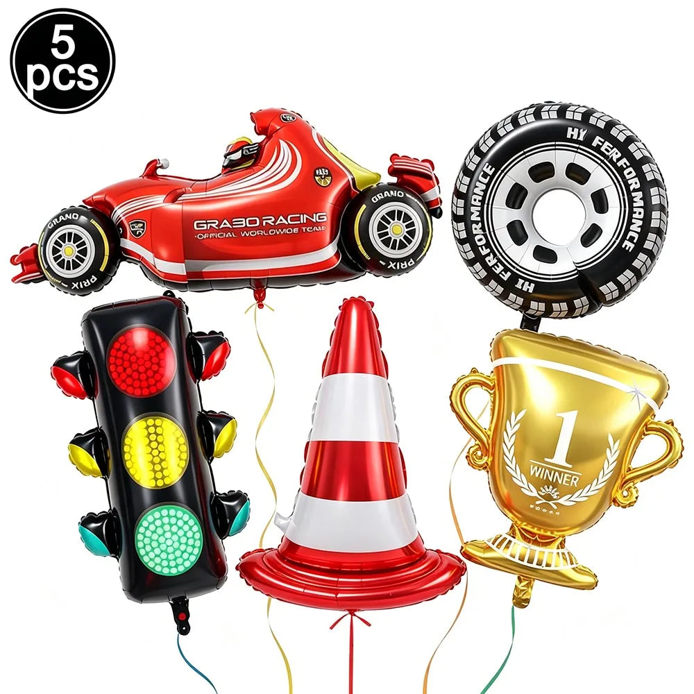 A set of five party decorations including a red race car balloon, a traffic cone, and a gold winner trophy.