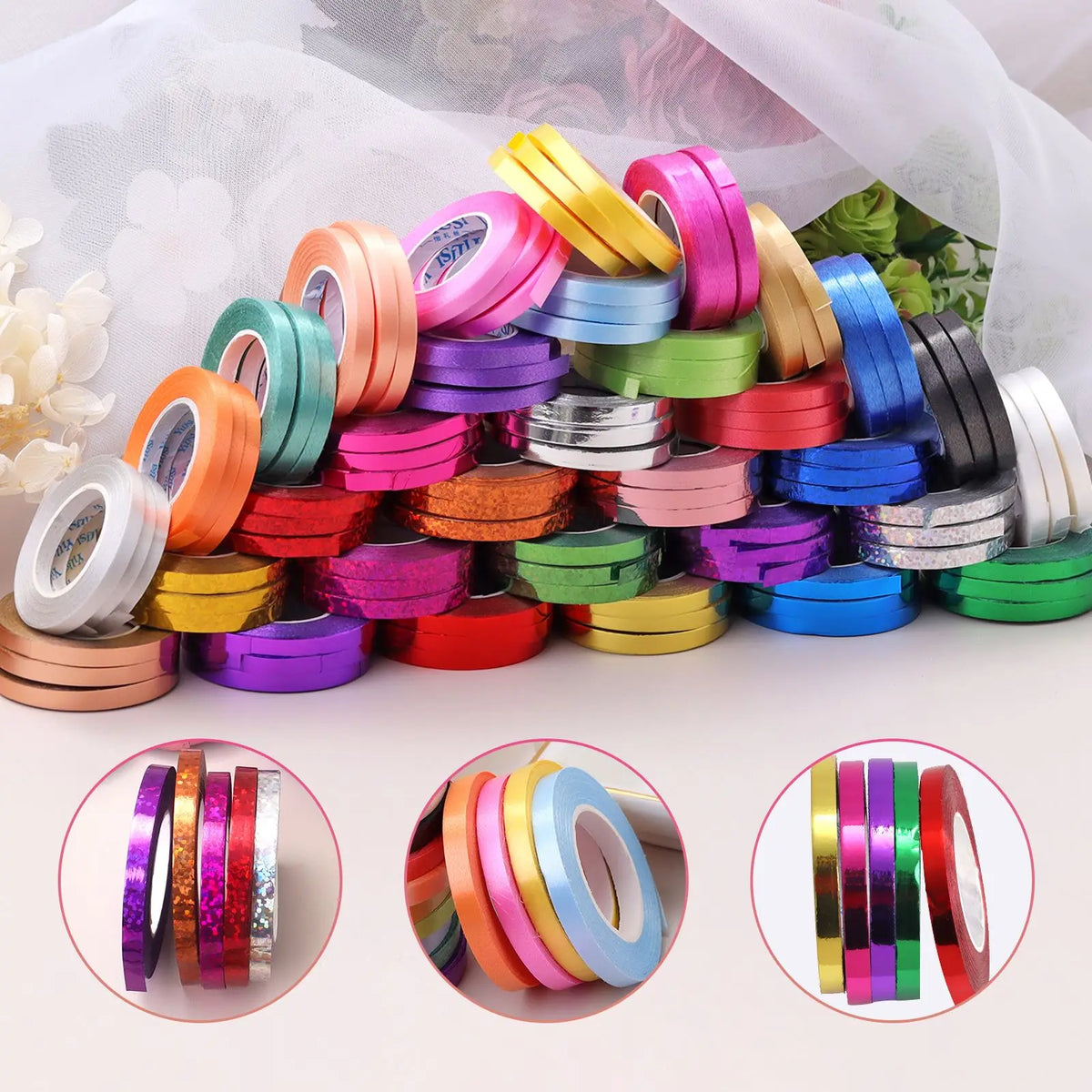 A collection of colorful satin balloon ribbon rolls in various shades and colors arranged on a white surface.