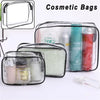 A clear waterproof cosmetic bag with a zipper containing various makeup products and skincare items.