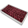 A box filled with artificial deep red roses used for wedding and party decoration.