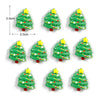 Un set de imanes navideños en forma de árbol de Navidad verde con estrellas amarillas y bases rojas.