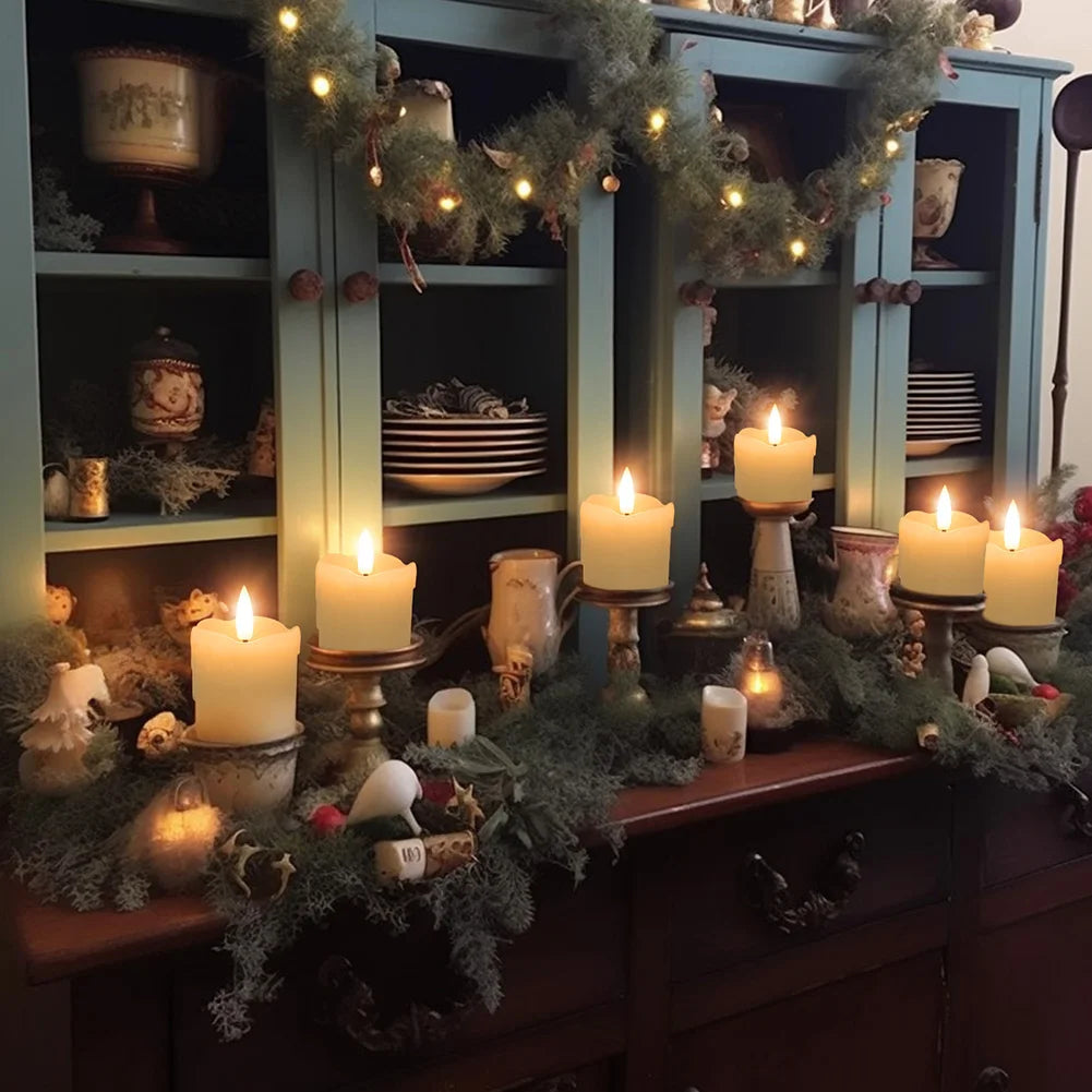 A display of glowing candles and greenery on a dark wooden cabinet.