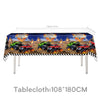 A tablecloth featuring a monster truck birthday party theme with various toy trucks and fireworks decorations.