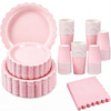 A pink scalloped paper tableware set including plates, cups, and napkins.