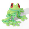 A bright lime green tree frog ornament with red eyes, sculpted in a movable 3D printed design.