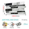 Self-adhesive marble wall tiles in various shades of black and white for DIY tiling projects