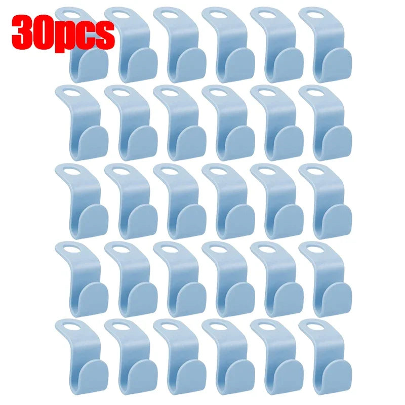 A set of 30 light blue space-saving hanger connector hooks for organizing items.