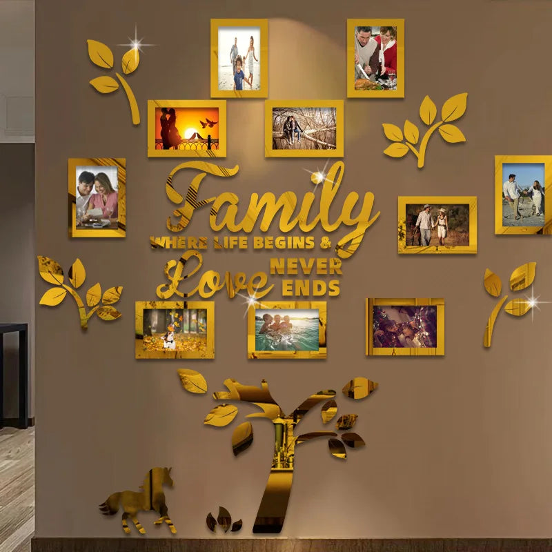 A wall collage featuring framed photos and gold leaf tree elements arranged in a family tree design.