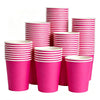 A stack of bright pink disposable paper plates in various sizes and colors.