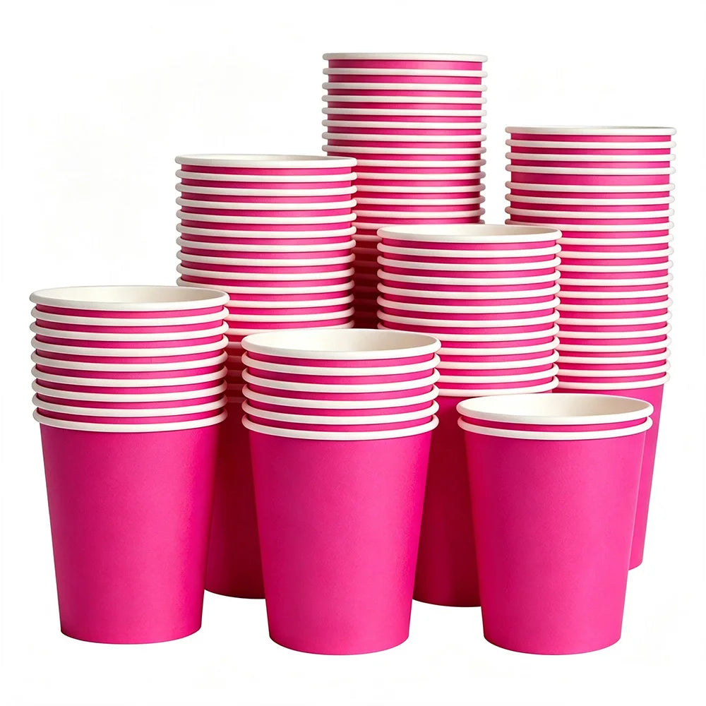 A stack of bright pink disposable paper plates in various sizes and colors.