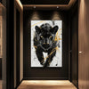 A canvas print featuring a black panther head in a gold and black abstract style displayed in a modern interior.