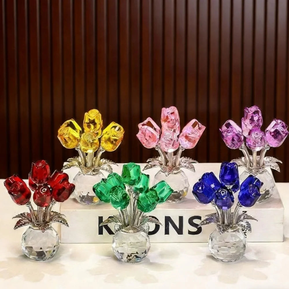 A collection of crystal rose decorative flowers in various colors like yellow, pink, purple, and blue displayed on a white su