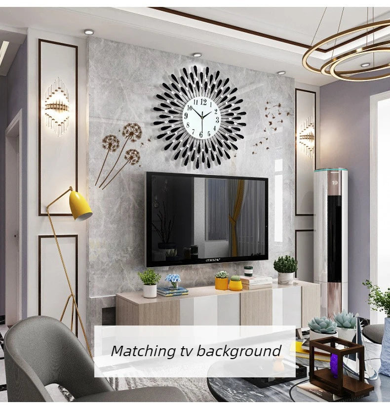 A modern minimalist metal wall clock is displayed on a gray textured wall above a television and furniture.