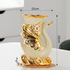 Gold ceramic swan vase for tabletop decor with a white body and gold accents.