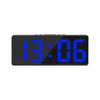 A black LED digital alarm clock displaying the time 13:06 with a nightlight feature.