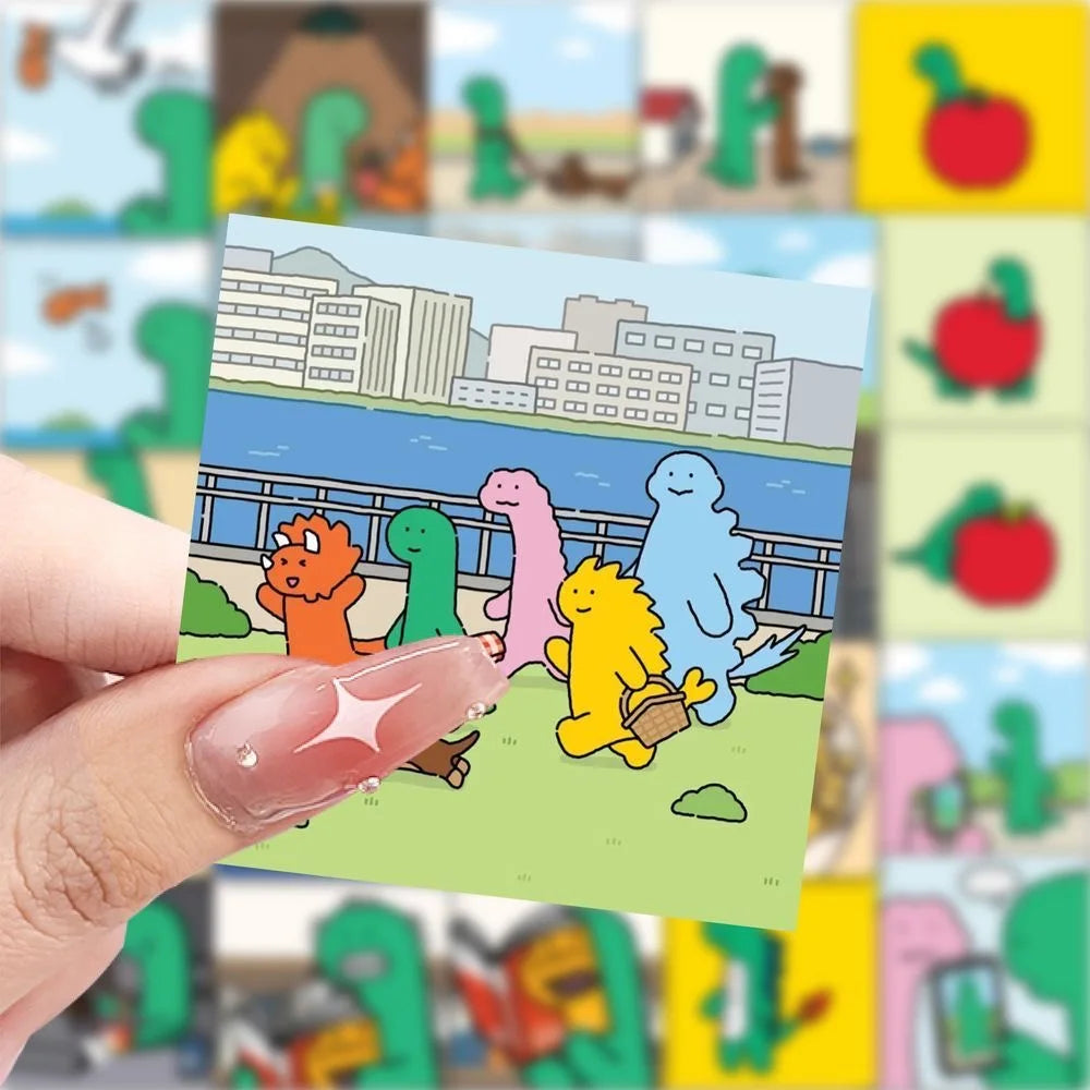 A hand holds a sticker card featuring cartoon dinosaurs and a cityscape background.