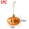 A single golden orange pumpkin hanging ornament with a wire loop.
