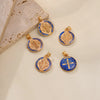 A set of twelve gold-toned double-sided St. Benedict medals featuring religious imagery and text on a white background.