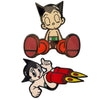An enamel pin set featuring an animated character with black hair and a light skin tone.